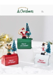 Close-up of colorful Christmas mailbox ornaments with Santa, elk, and snowman details