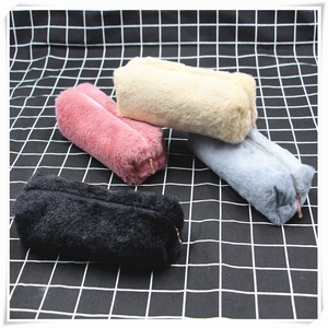 Set of four plush pencil cases in white, pink, gray and black with golden zippers