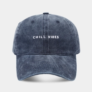 Navy blue washed cotton baseball cap with white Chill Vibes embroidery in a vintage style