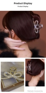 Detail of golden bow hair claw clip with rhinestones and large central pearl inlay