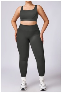 Close-up of charcoal grey high-waist leggings and sports bra set for professional fitness