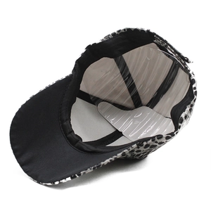 Fashionable leopard print faux leather baseball cap in black and white pattern for adults