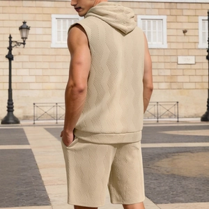 Men's sleeveless knitted hoodie and shorts set in beige with textured fabric
