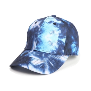 Detail of blue and white tie-dye pattern on a six-panel structured baseball cap