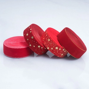 Red velvet ribbon set with gold star prints and polka dots for Christmas gift wrapping