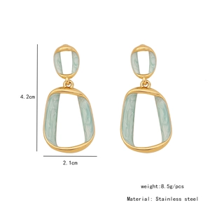 Detail view of geometric gold stainless steel earrings with blue marble texture and dimensions