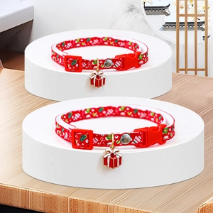 Detail of red Christmas pet collar with gift box pendant and adjustable buckle
