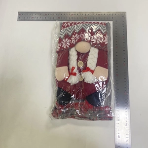 Detailed view of a Christmas gnome doll in red and grey fabric measuring 33cm in height
