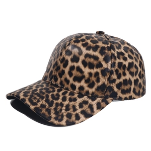 Close-up of the leopard print faux leather texture and reinforced stitching on the baseball cap