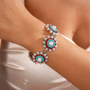 Detail of vintage bohemian flower necklace with white faux pearls and turquoise beads
