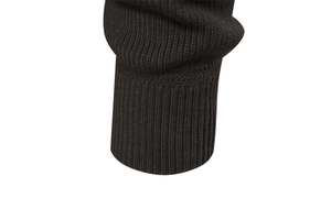 Close-up of ribbed elastic cuffs on a high-quality black knitted men's cardigan jacket