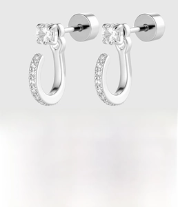 Detail of silver U-shaped zircon earrings made of titanium steel with crystal accents