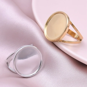 Macro view of gold and silver round bezel ring bases for DIY jewelry making