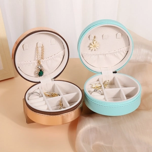 Portable round PU leather jewelry box for rings and earrings in rose gold and mint