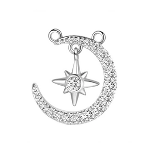 Macro detail of silver celestial pendant with moon and star zircon stone inlay