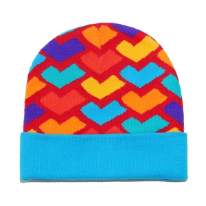 Colorful knitted beanie with vibrant heart patterns and light blue folded brim