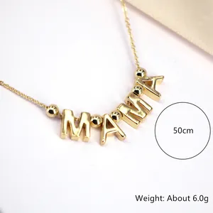 Macro detail of gold Mama pendant necklace with dimensions 50cm and weight 6.0g