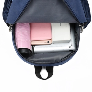 Internal storage capacity of a navy blue dinosaur backpack for kindergarten children