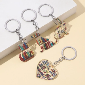 Set of four acrylic bookshelf keychains featuring cute cat, dog, rabbit, and heart designs