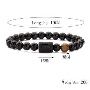 Detail view of Scorpio zodiac bracelet with 8mm tiger eye beads and 19cm elastic band