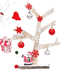Mini wooden Christmas tree ornament with festive balls and Santa figurine for table decor