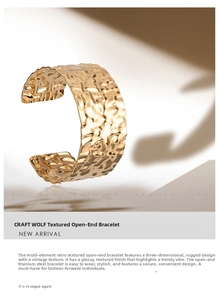 Detail of wide gold cuff bracelet featuring a textured hammered finish in titanium steel
