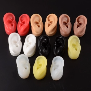 Macro display of assorted silicone ear models in multiple colors for jewelry and hearing aids