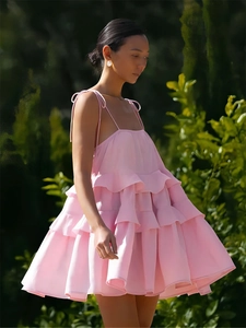 Summer pink tiered ruffle mini dress with spaghetti straps and open back for beach trips