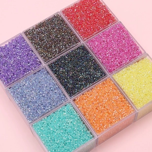 Colorful 2.5mm glass seed beads set in a 9-compartment clear acrylic storage box