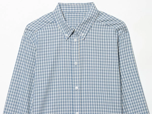 Detail of blue and white plaid shirt showing button-down collar and fabric texture