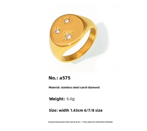 Detailed view of 18K gold plated stainless steel signet ring with three star-set diamonds