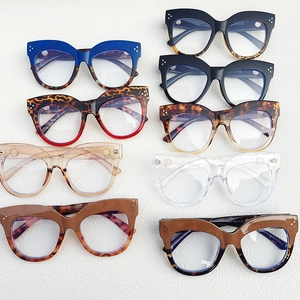Retro oval cat eye eyewear frames with metal rivet accents in various stylish colors