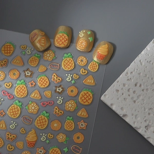 Detailed view of 3D embossed pineapple and fruit nail art stickers with relief texture
