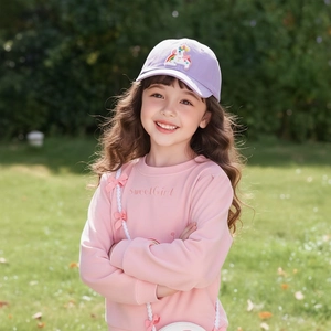 Detailed view of pink sweetGirl sweatshirt and purple unicorn patch baseball cap for girls