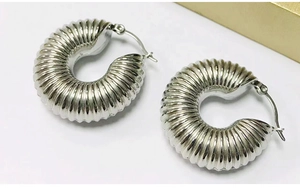 Stylish chunky ribbed hoop earrings for women, trendy silver tone metal geometric jewelry.