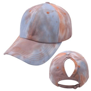 Detailed view of tie-dye ponytail baseball cap with back cutout and adjustable metal buckle