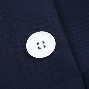 Classic A-line navy mini skirt featuring decorative white double-breasted buttons