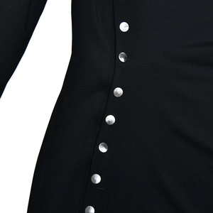 Detail of black knitted dress featuring a side opening with silver metal buttons