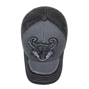 Vintage denim baseball cap with cow skull embroidery and distressed frayed edges