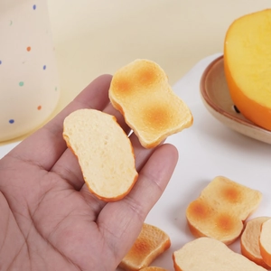 Realistic mini PVC toast slice model for keychains and bags featuring a golden baked finish