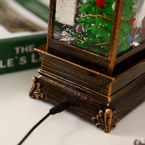 Detail of the vintage bronze lantern base showing the DC power port and realistic textures