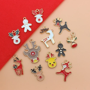 Detailed flat lay of eleven colorful enamel Christmas charms featuring reindeer and gingerbread men