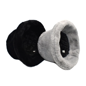 Detailed close-up of thick plush bucket hat lining and 100% polyester wash label
