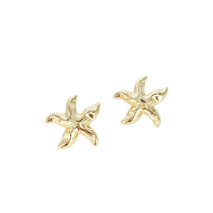 Minimalist golden starfish stud earrings with a polished metallic finish on white background