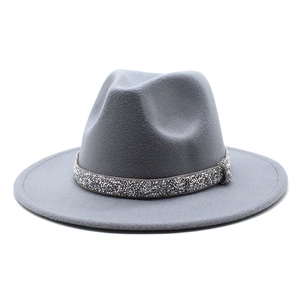 Detailed texture of grey wool felt jazz hat featuring a sparkling rhinestone band ornament