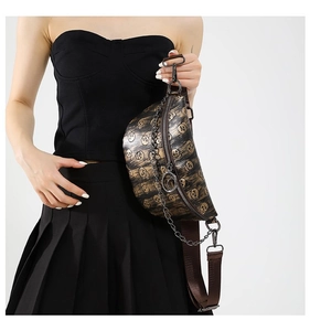 Close-up of skull print waist bag featuring metallic chain and faux leather texture