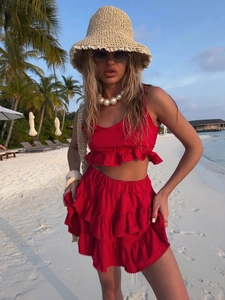 Detailed view of red lace-trim ruffled two-piece set featuring a cropped top and tiered skirt