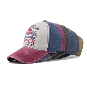 Multiple colors of vintage washed cotton baseball caps with distressed brim details
