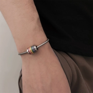 Unisex stainless steel snake chain bracelet with rainbow striped cylindrical bead detail