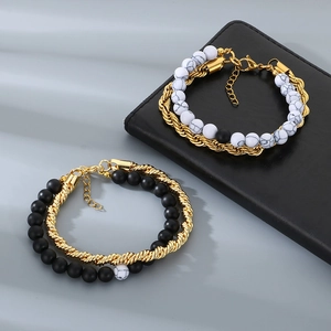 Detail of double-layer stainless steel twist chain bracelet with matte black and marble beads